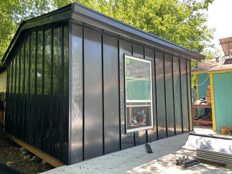 Black standing seam metal wall panels for Roof Inspection in Riverdale